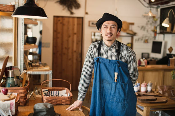 Mid adult man working in own retail store