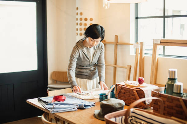 istock Female owner working in General shop. 674504284