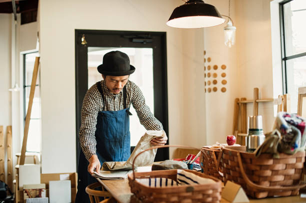 istock Male owner working in general shop. 674504320