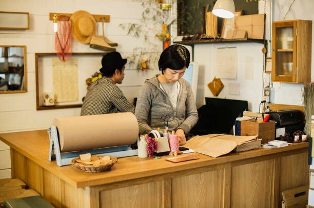 istock Two owners working together in general shop. 674504436