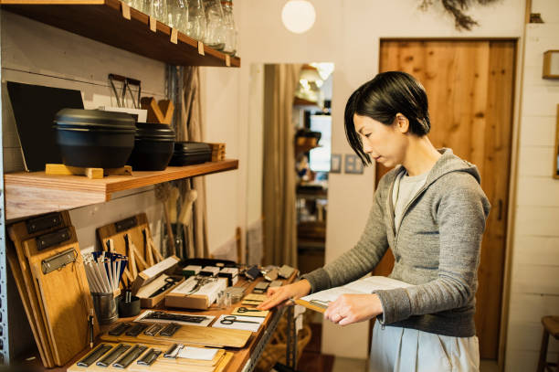 istock Female owner working in General shop. 674504454