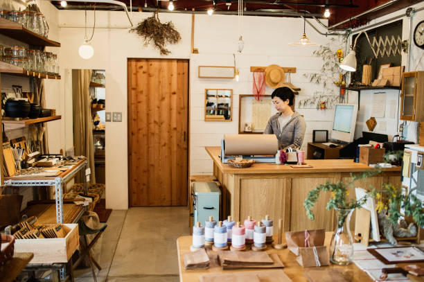 istock Female owner working in General shop. 674504466