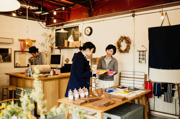 istock Mid adult man working in own retail store 674504538