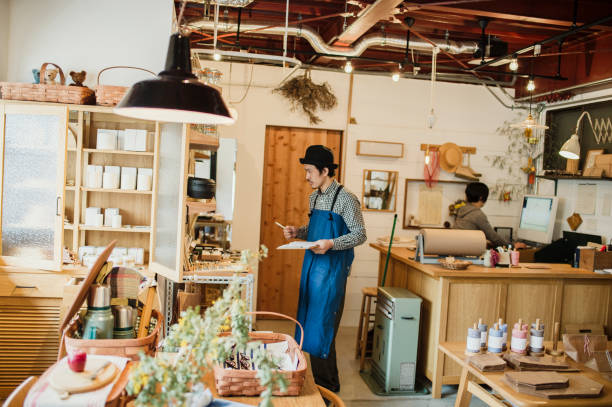 istock Male owner working in general shop. 674504626