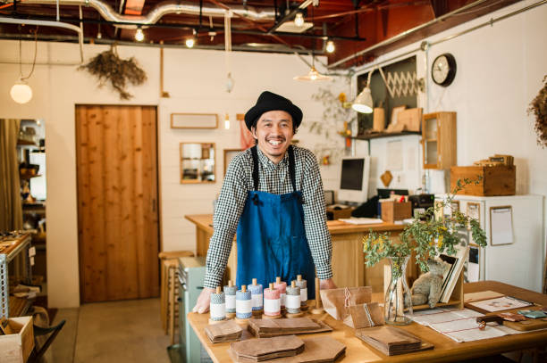 Mid adult man working in own retail store