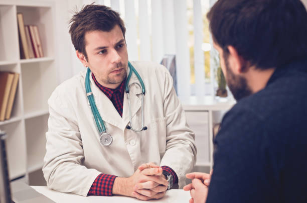 istock Young doctor and his patient talking about patients problems 674504958