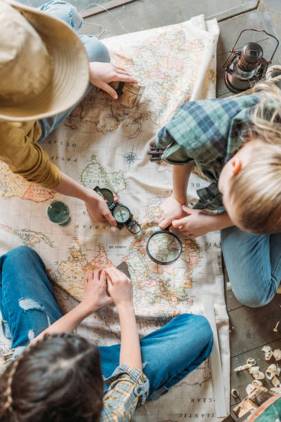 istock cute kids playing treasure hunt with map on porch 674505128