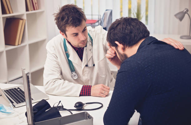istock Doctor consoles his patient 674505658