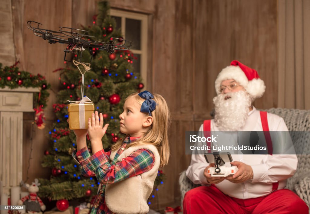 Santa Using Drones Santa With Kid Using Hexacopter Drone Stock Photo - Download Image Now ...