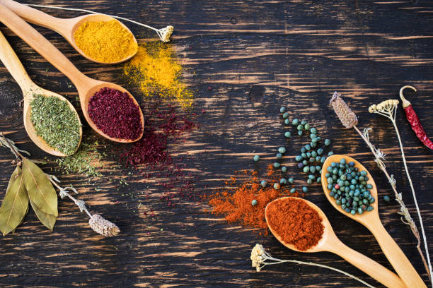 istock Spices and herbs on wooden background 674522042