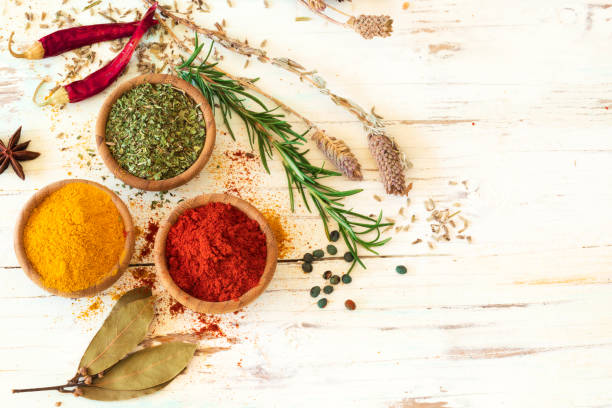 istock Spices and herbs on wooden background 674522448