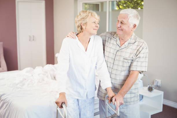 istock Senior smiling couple with walker 674534798