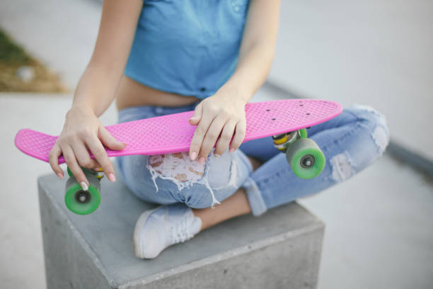 istock girl with skateboard 674535076
