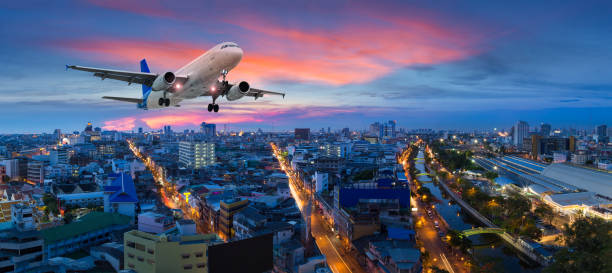istock Airplane take off over the panorama city at twilight scene 674535280