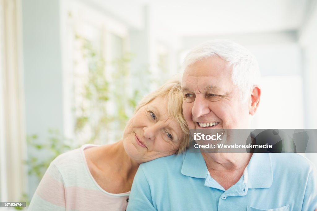 Happy senior couple smiling at home Happy romantic senior couple smiling at home Senior Couple Stock Photo