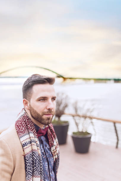 istock Close up of a beautiful man with scarf 674550272