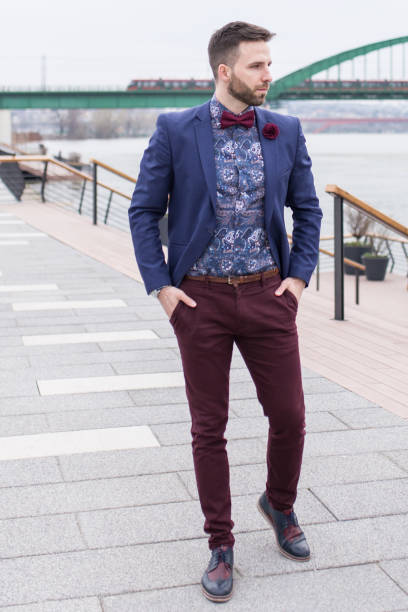 istock Handsome young adult walking down the quay 674551330