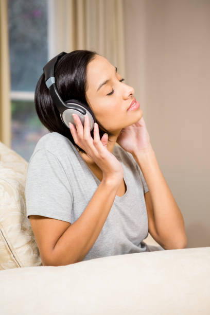 istock Peaceful brunette with headphones 674558566