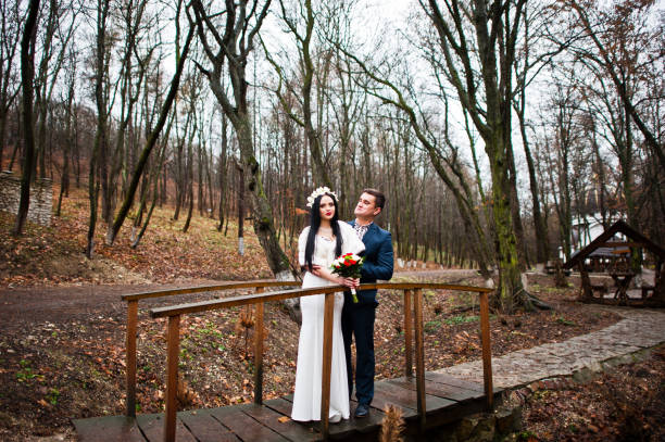 istock Graceful wedding couple background wood with no deciduous trees 674563874
