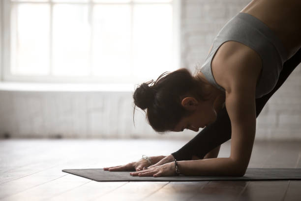 istock Young woman in One Sided Fold pose, white studio, closeup 674564128