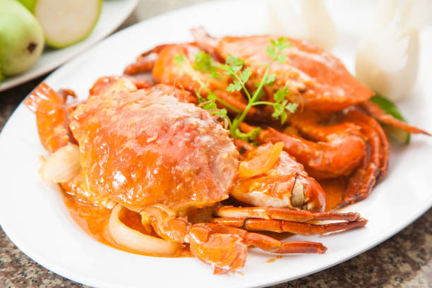 istock Fried red crab soup with herbs on white dish 674564180