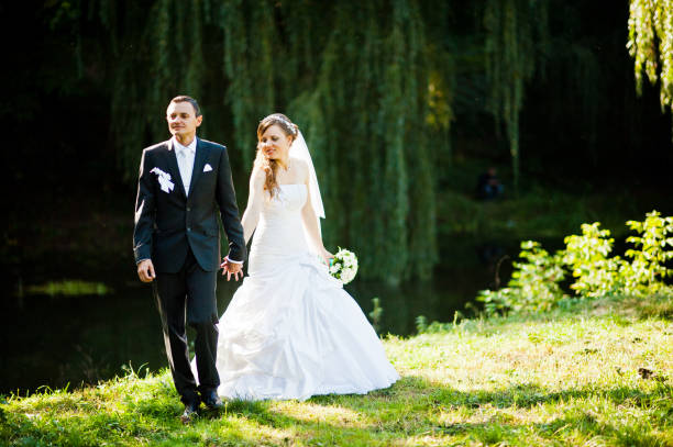 istock Wedding couple at sunset at yellow autumn park 674567350