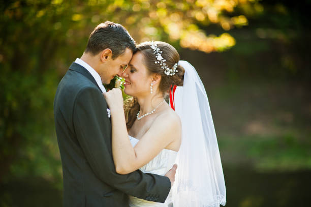 Wedding couple at sunset at yellow autumn park