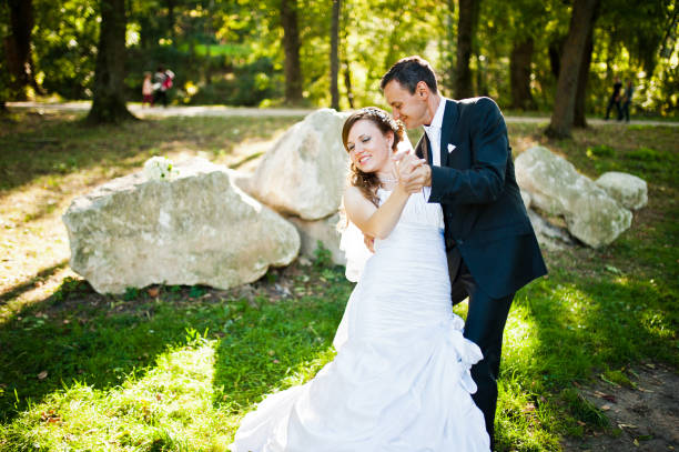 istock Dancing wedding couple outdoor background big stones 674567634