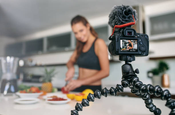 istock Young female blogger recording content for videoblog in Kitchen. 674567672