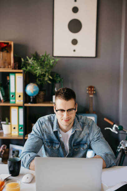 istock Student is writing an essay on the laptop 674567832