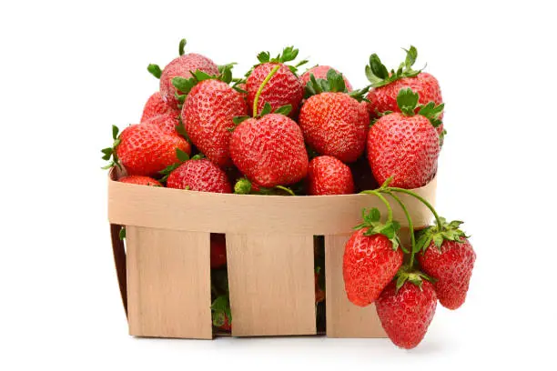 Photo of Strawberry in basket isolated on white background