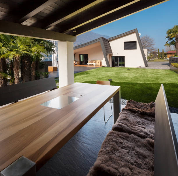istock Veranda of modern villa overlooking the garden 674572298