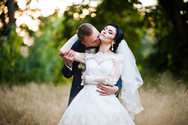 istock Wedding couple in high dry grass 674574650