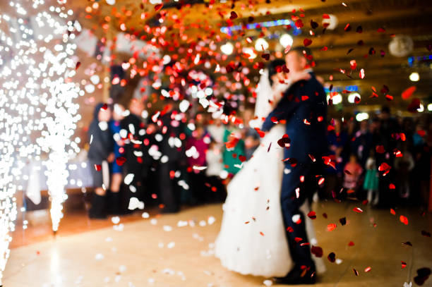 istock First wedding dance with fireworks and confetti, blured focus 674574748