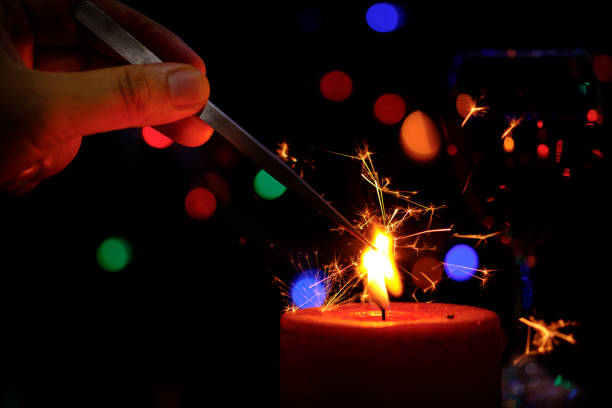 istock Concept of burning sparklers in candle burning brightly 674574836