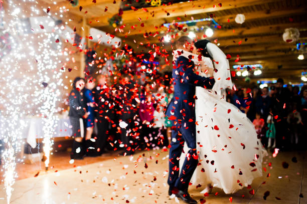istock First wedding dance with fireworks and confetti, blured focus 674574842