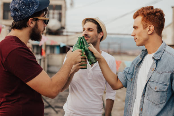 A couple guys on board toasting with their drinks