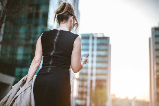 istock Business woman texting on her phone 674578224