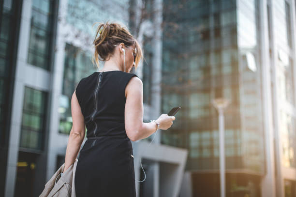 istock Business woman texting on her phone 674578246