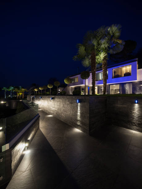 istock Exterior of luxurious modern villa, night scene 674581658
