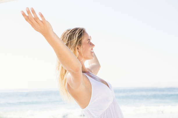 istock Blonde woman relaxing on the beach 674585314