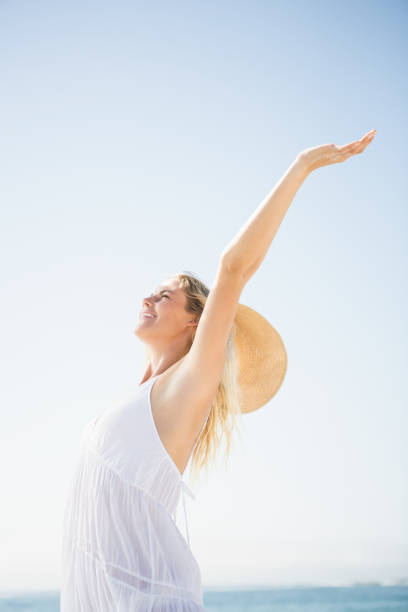 istock Blonde woman relaxing on the beach 674585506
