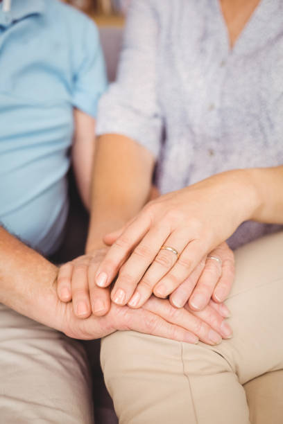 istock Close-up of couple holding hands 674585768