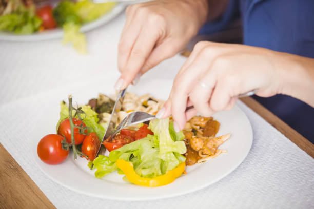 istock Close-up of woman having breakfast 674586332