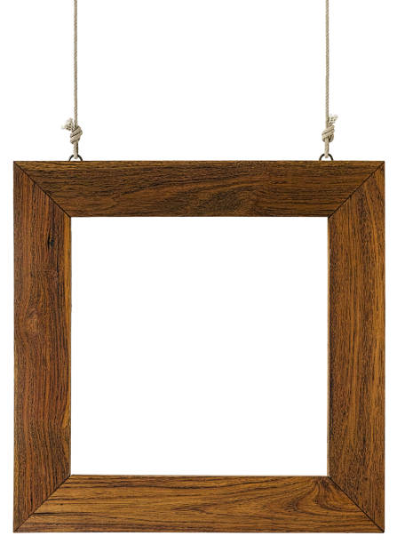 istock Old weathered worn natural wooden framed panel, hanging by old rope isolated on white, clipping path included. 674589252