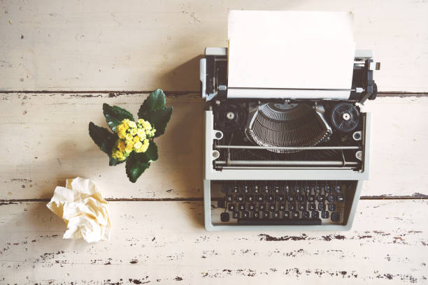 istock Vintage typewriter on  wooden background 674591846
