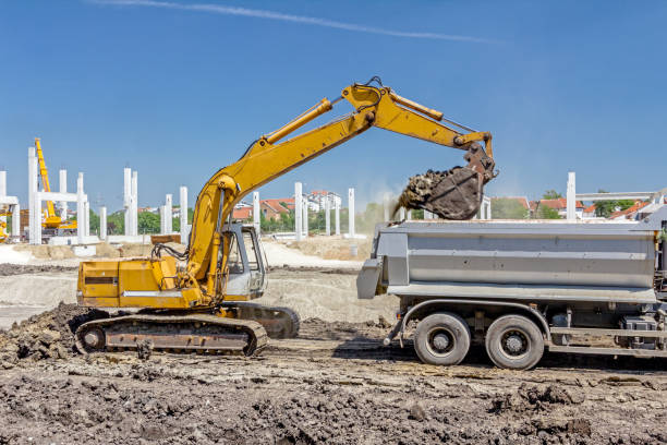 istock Excavator is loading a truck on building site 674596398