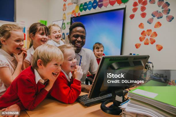 Computer Lesson At School Stock Photo - Download Image Now - Teacher, Education, School Building