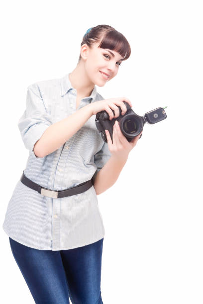 istock Professional Female Photographer Holding a Camera and Smiling 674596858