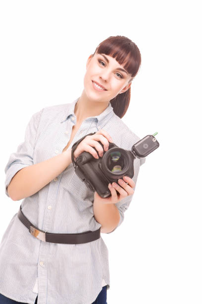 istock Female Photographer Holding a Camera and Smiling. Vertical Image. 674597138